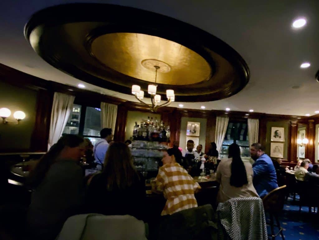 People sitting around the bar at the Round Robin