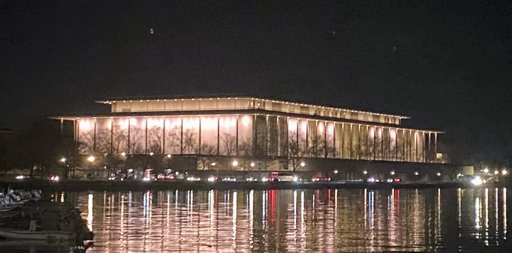 Kennedy Center lit up along the Potomac River in Washington DC at night