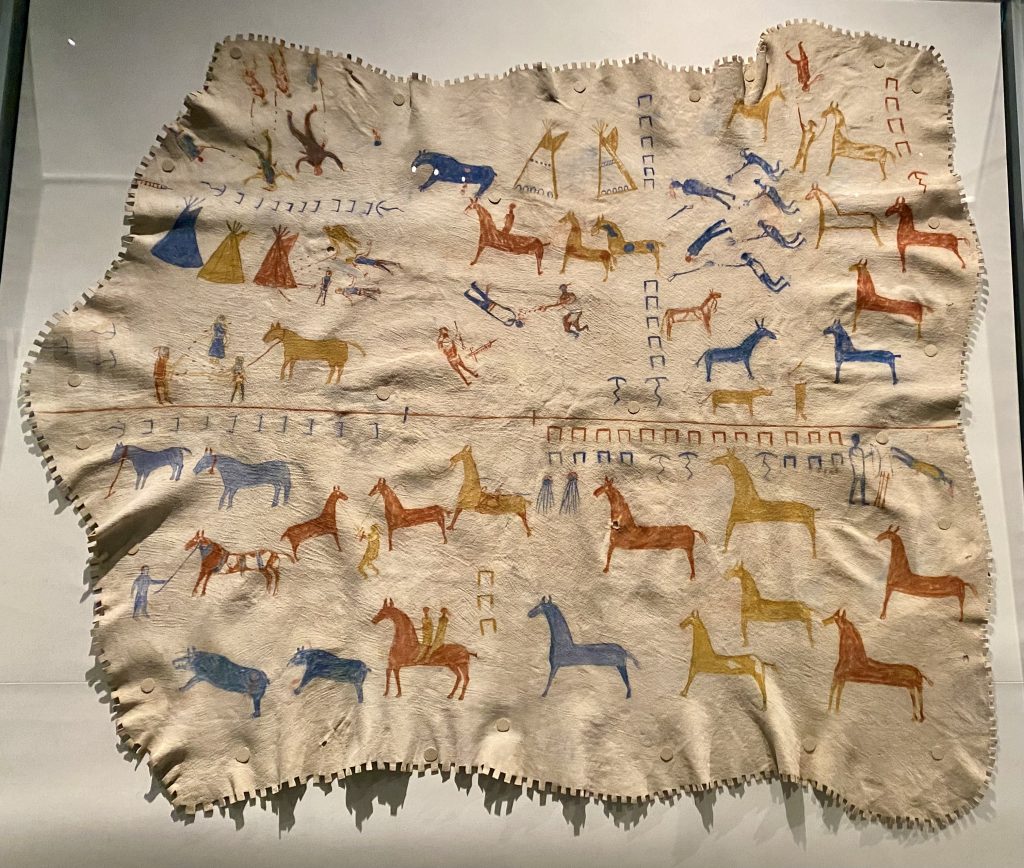 animal hide decorated with blue, yellow, and red horses at the National Museum of the American Indian in Washington DC