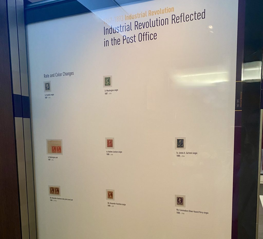 Museum display with six different postage stamps highlighting the Industrial Revolution