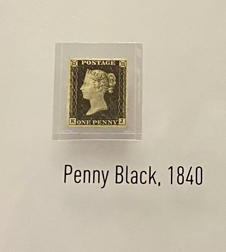 Black one penny postage stamp with profile of woman, Penny Black, 1840
