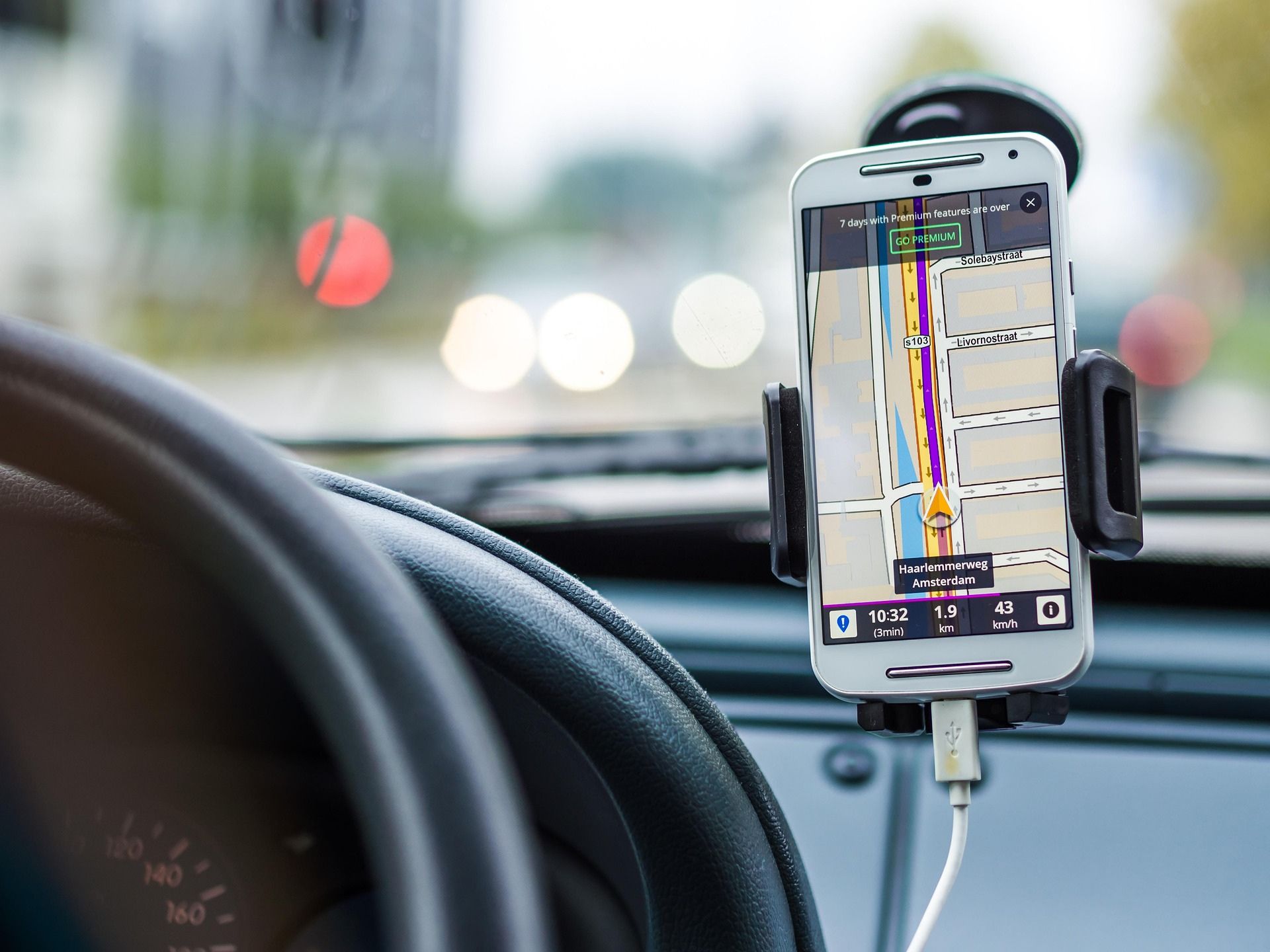 cell phone GPS in front window of car